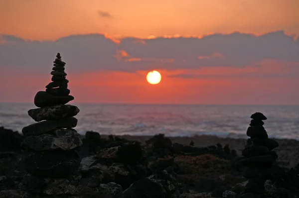 Fuerteventura: rock castles in backlight at sunset at Punta de la Ballena