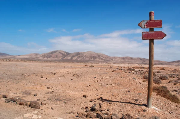 Fuerteventura: dirt road and signs of walking path to the beaches of the northwestern coast