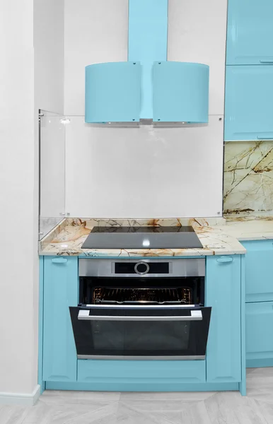 Oven with extractor fan in the kitchen. Minimalism