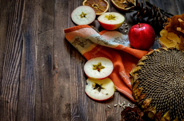 Vintage autumn red apples on wooden background