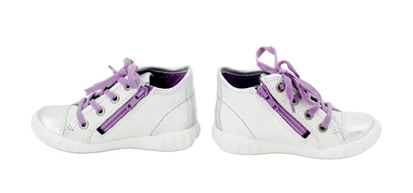 White leather sneakers with purple shoelace.