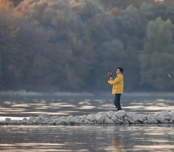 Man fishing on river
