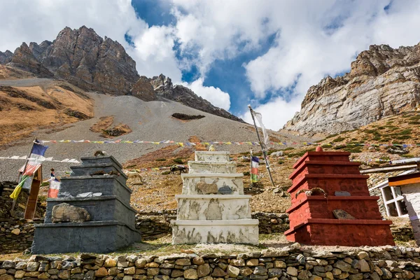 Three stone stupas under Thorong La pas.