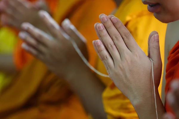 Buddhist monks praying hands