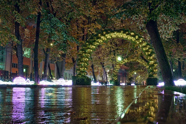 Passion Boulevard, Moscow, Russia. Street decorations in the form of an light arches of sunflowers at night.