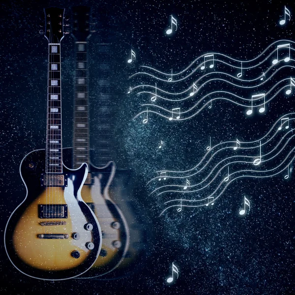 Creative image of guitar and notes in space. Music concept