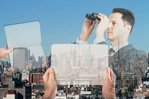 Man using binoculars to look into the distance on city background with hands holding notepads. Research concept. Double exposure