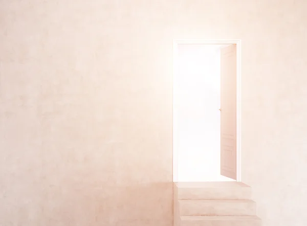 Open door in concrete sunlit wall with stairs