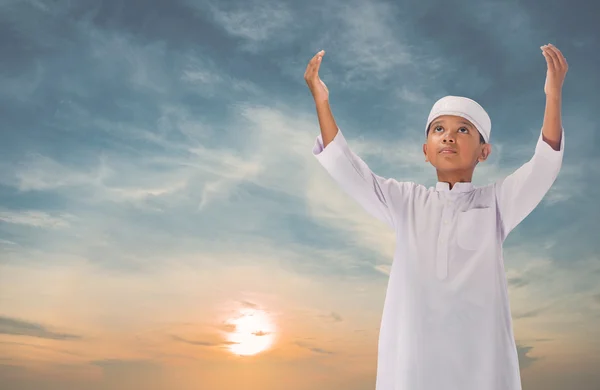 Muslim child praying for Allah, muslim God