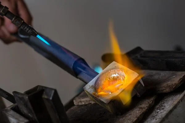 Melting Silver Grains in crucible with blowtorch