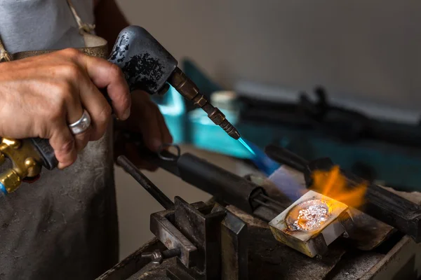Melting Silver Grains in crucible with blowtorch