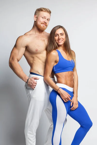 Two athletic young people - man and woman