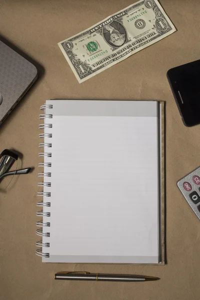 Office desk top view with blank notebook