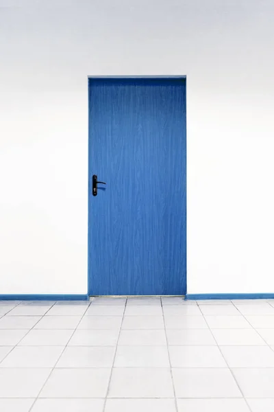 Wooden door on a clean wall indoors