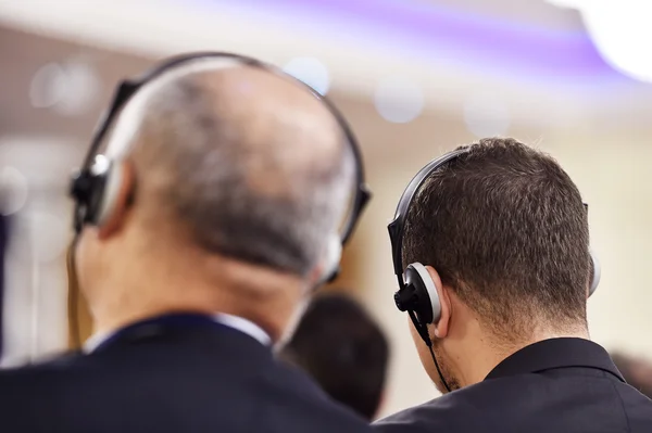 Man using headphones for translation