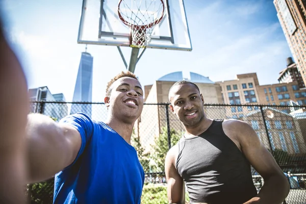 Basketball players training on court