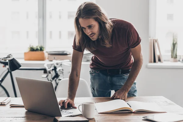 Young businessman with long hair