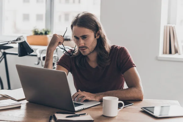 Young businessman with long hair