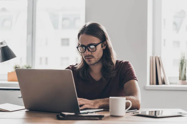 Young businessman with long hair