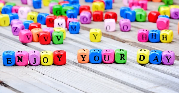Enjoy your day words on table