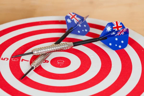 Darts arrow with Australia flags on red dart board ,