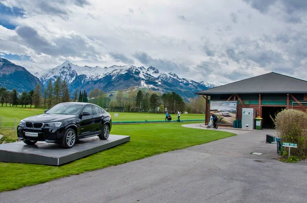Luxury BMW X6 on pedestal in Golf club