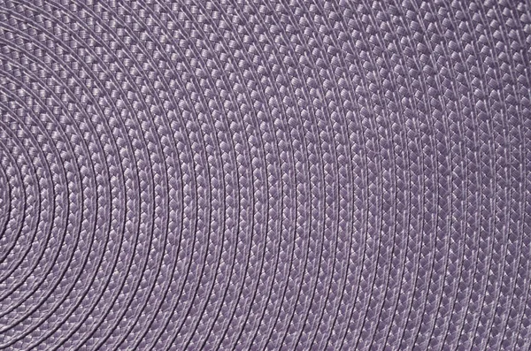 Violet rattan woven mat closeup