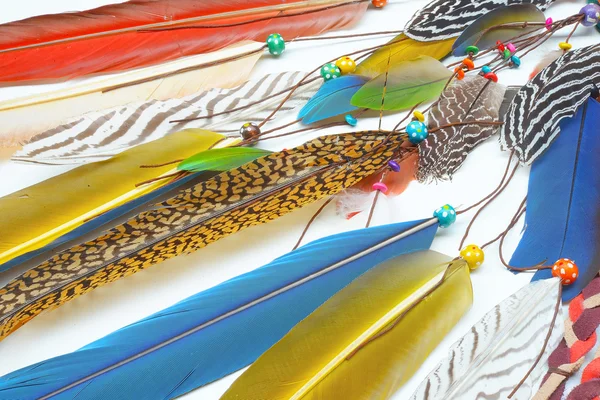 Decoration from feathers and gemstones. Boho style background