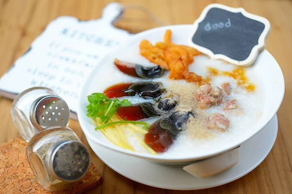 Congee with preserved eggs , boiled rice soup