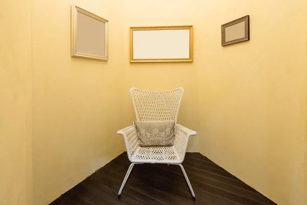 Interior of room with old fashion armchair and picture frame in