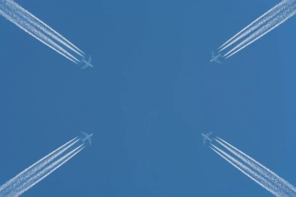 Planes in the sky with contrails.