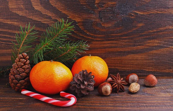 Christmas spirit: nuts, tangerines, Christmas tree