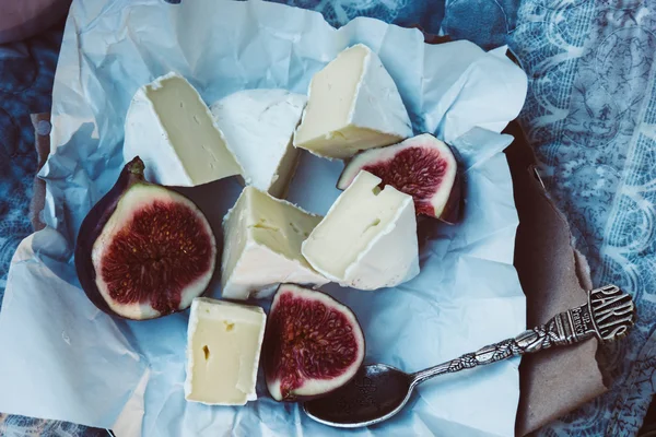 Camembert cheese with figs and vintage tea spoon