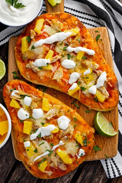 Homemade hawaii Flatbread Pizza with chicken and pineapple dressing yogurt sauce.