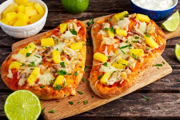 Homemade hawaii Flatbread Pizza with chicken and pineapple dressing yogurt sauce.