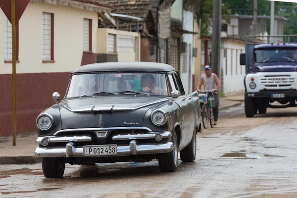 Villa Clara, Cuba - September 10, 2016: American blue Dodge classic car drive on the street through the suburb from Santa Clara Cuba - Serie Cuba 2016 Reportage