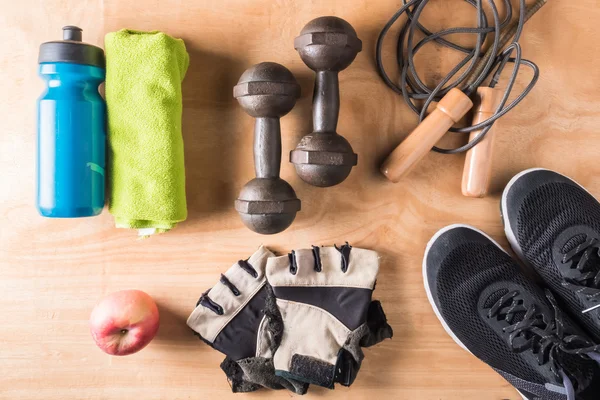 Top view of Sport stuff on wooden table background, Fitness lifestyle concept