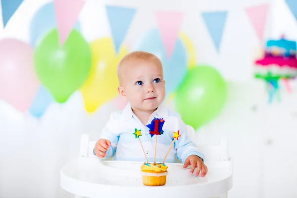 Little baby boy celebrating first birthday