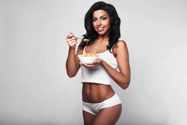 Healthy fitness woman eating quick breakfast