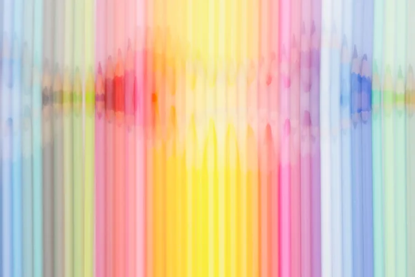 Abstract background of colored pencils in rainbow order.