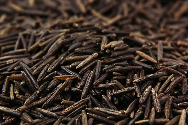 Black rice close-up background.