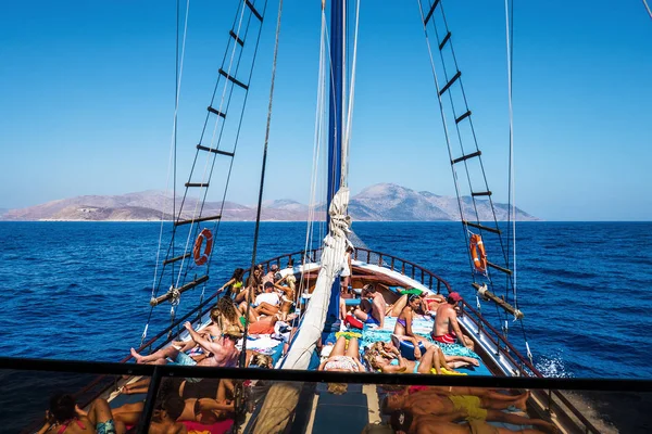 People sunbathing in yacht off the coast of Greece