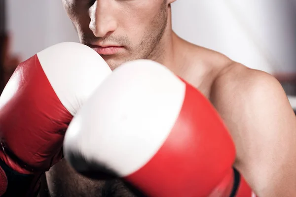 Close-up of young man in boxing position