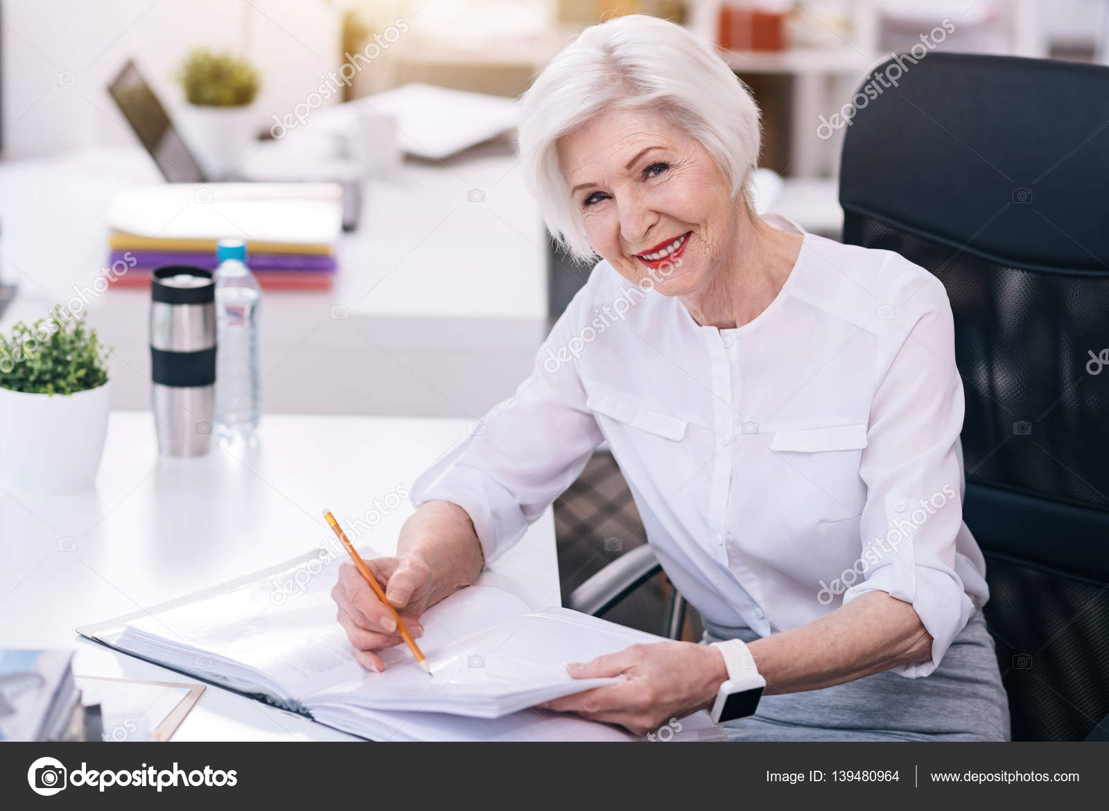 Business lady aged happy gives