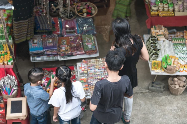 Family shopping on city market