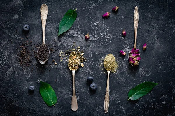 Dry tea in tea spoons