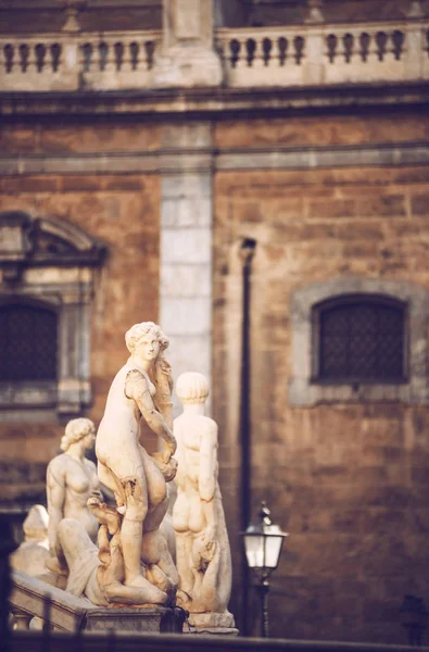 Detail view of baroque fountain with nude statues on piazza Pret