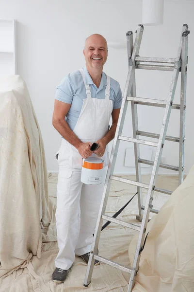 Portrait Of Decorator Painting Room