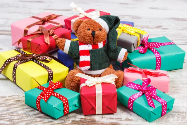 Teddy bear with colorful gifts for Christmas or other celebration