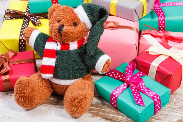 Teddy bear with colorful gifts for Christmas or other celebration